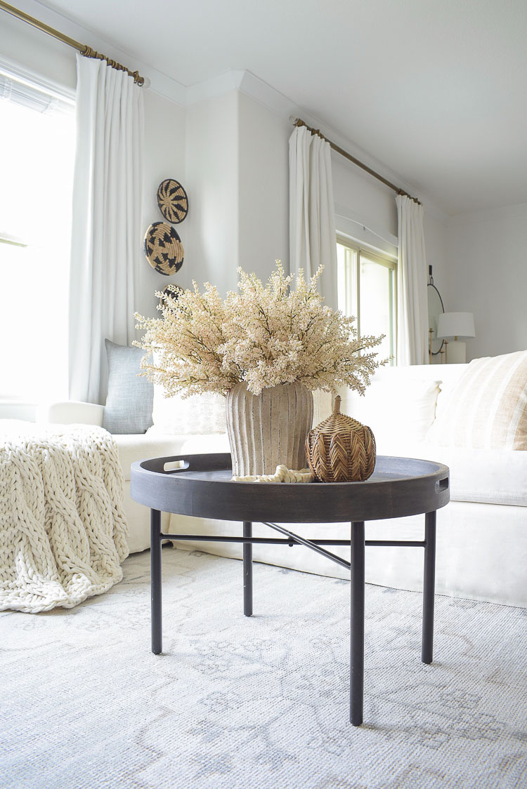 Fall coffee table decor - rattan pumpkin, cream terra cotta vase