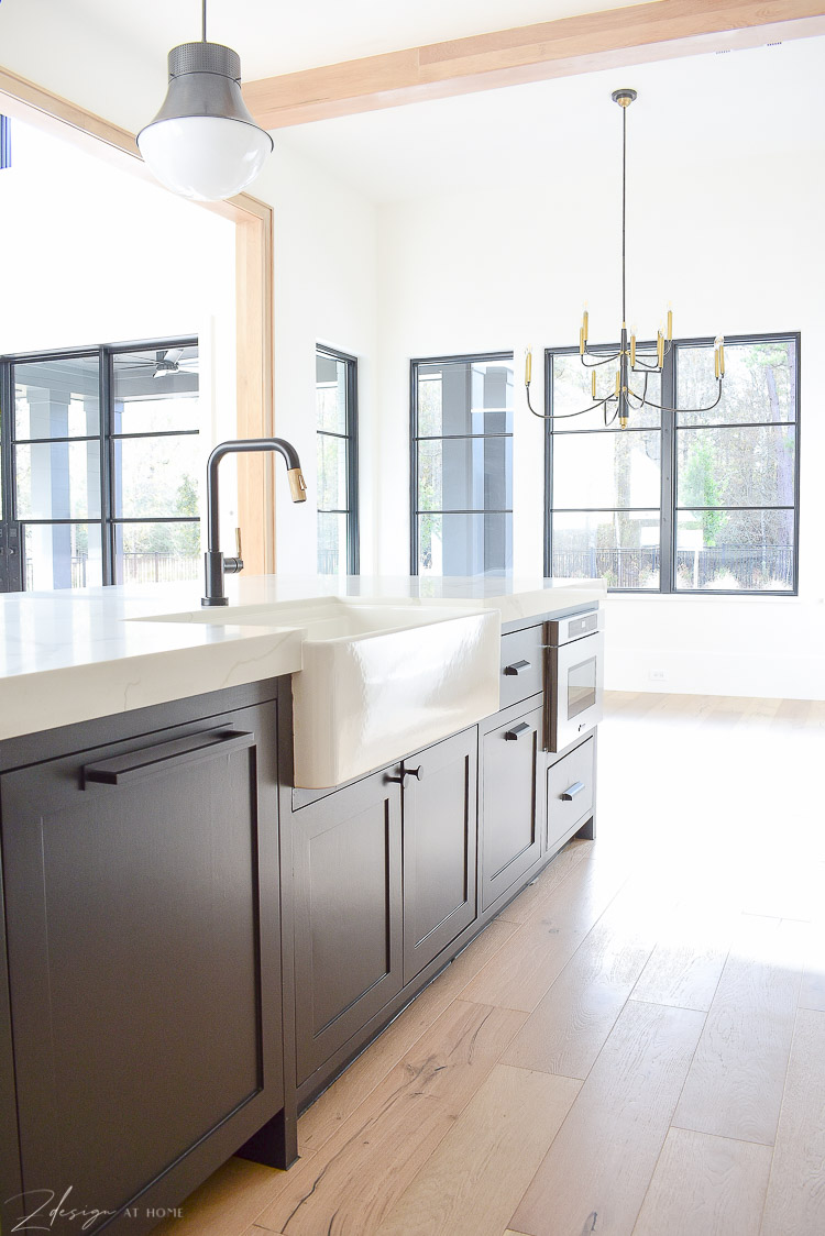 Blanco farmhouse sink, black kitchen island, little brizo faucet in black