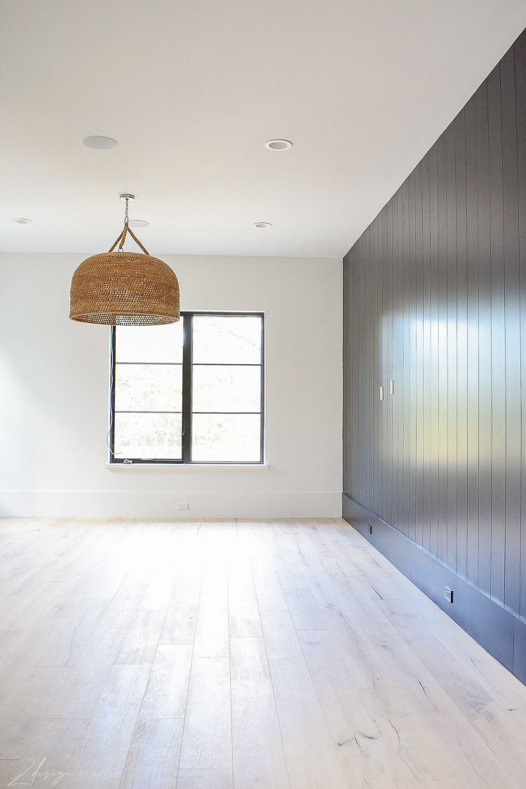 Game room with vertical black shiplap wall