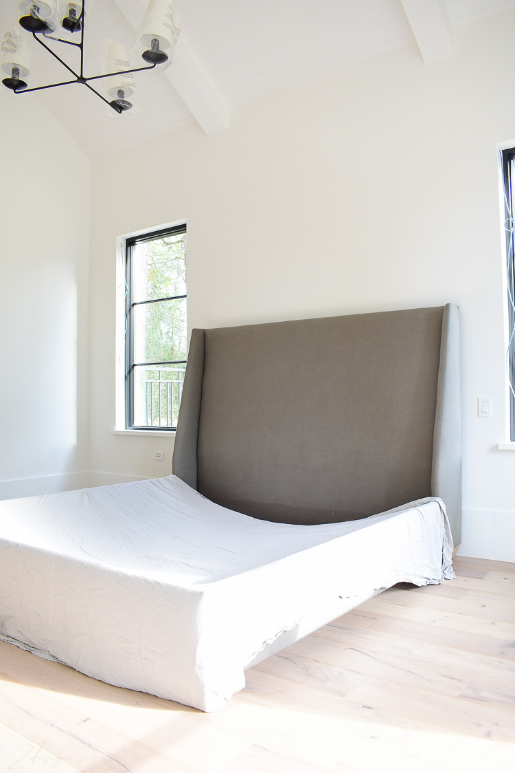 white master bedroom with walt bed snowbound on walls 