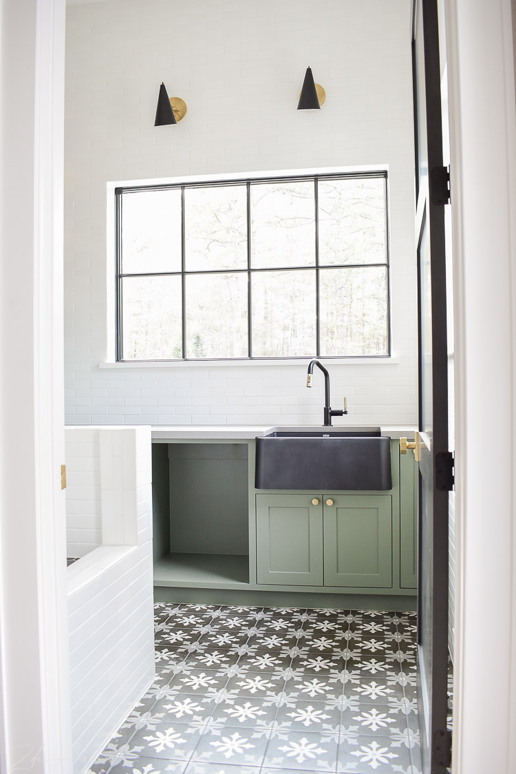 Beautiful laundry room, sink at window, black and white patterned floors, dog wash