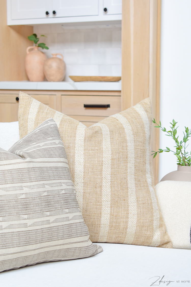modern farmhouse pillows styled on sofa 