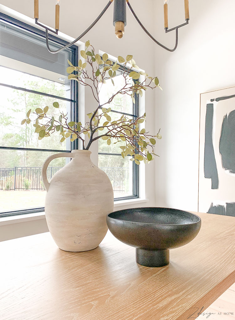 black modern CB2 bowl and olive jar