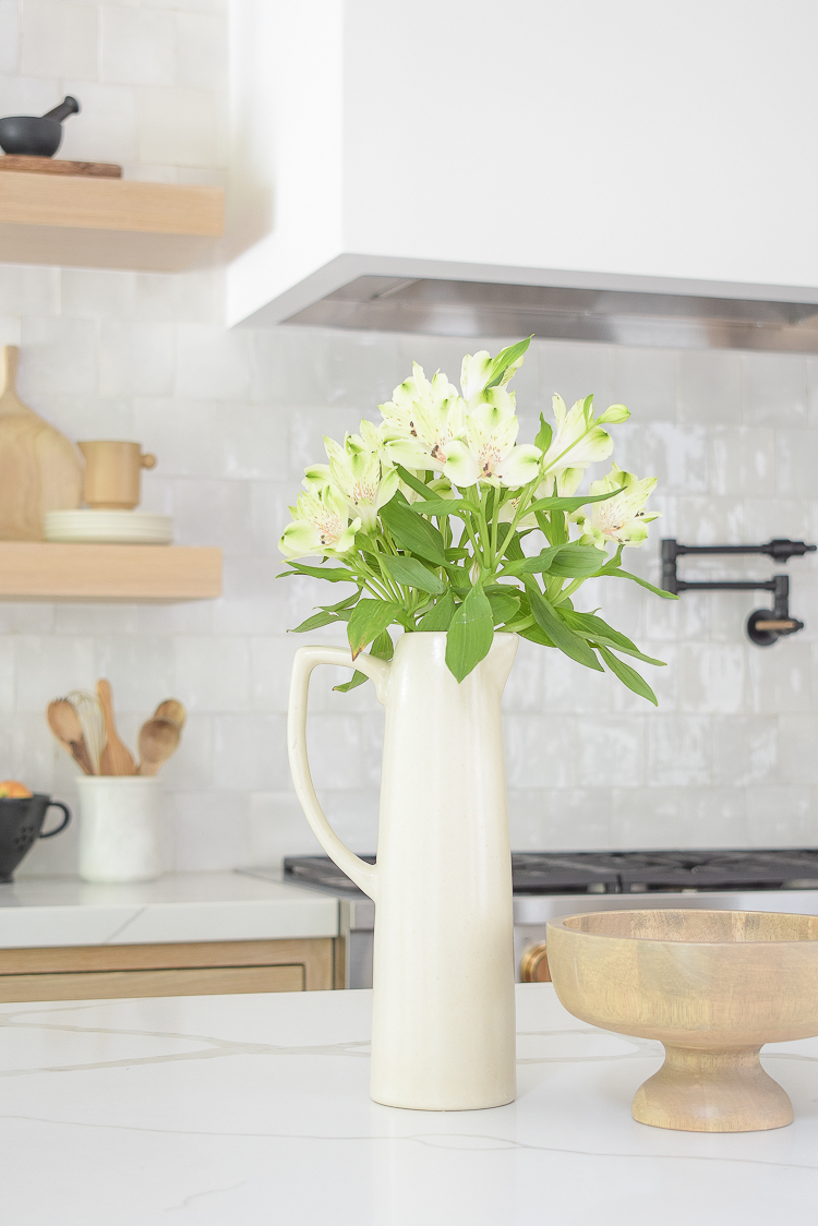 modern pitcher vase in front of zellige tile in modern kitchen