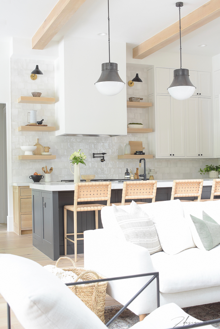 View from living room to modern kitchen with 3 cabinet colors