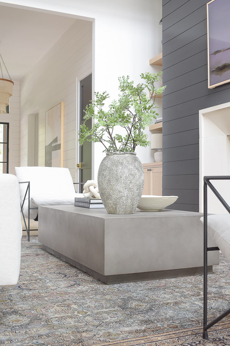 concrete coffee table in a living room reveal