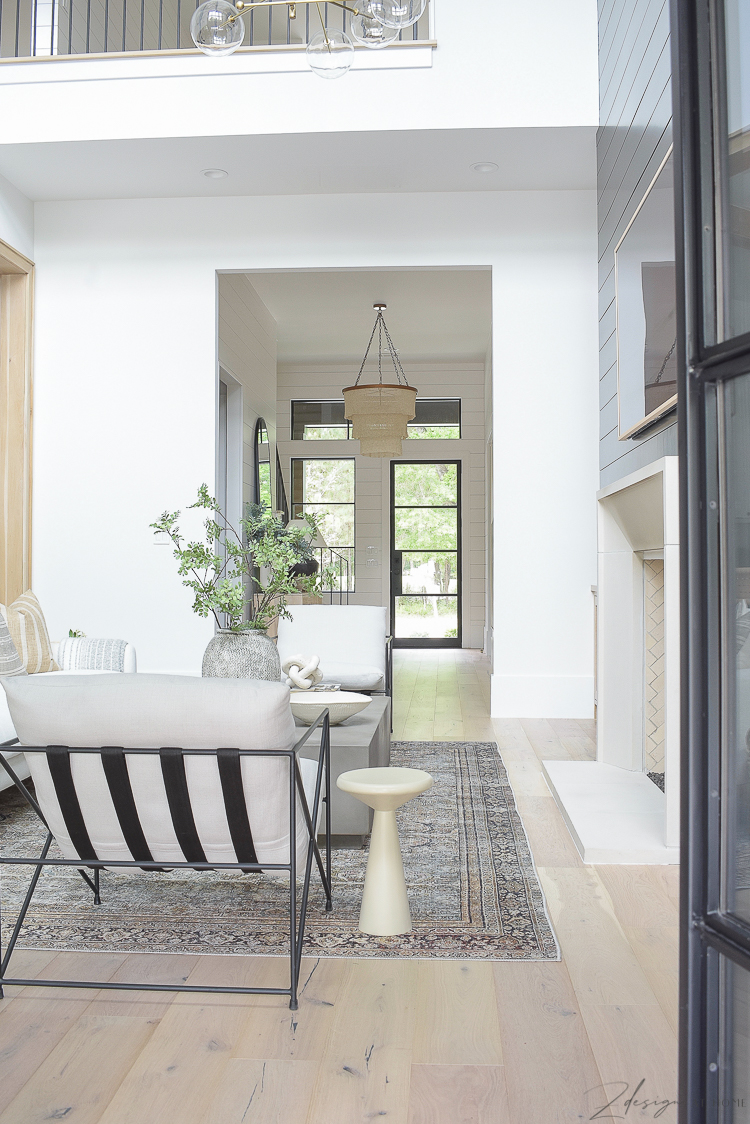 transitional modern living room reveal with patricia round chandelier and sherwin williams snowbound paint color 