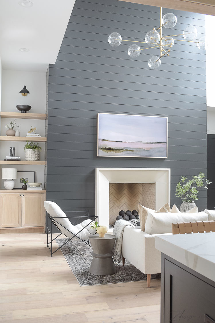 modern living room with black shiplap fireplace