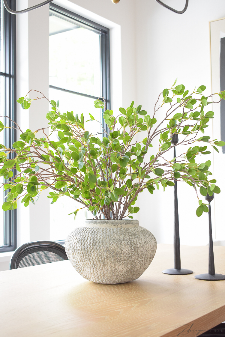 textured gray vase on farmhouse dining table, best faux green stems