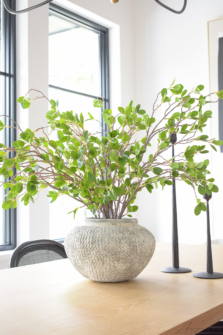 textured gray vase on farmhouse dining table, best faux green stems