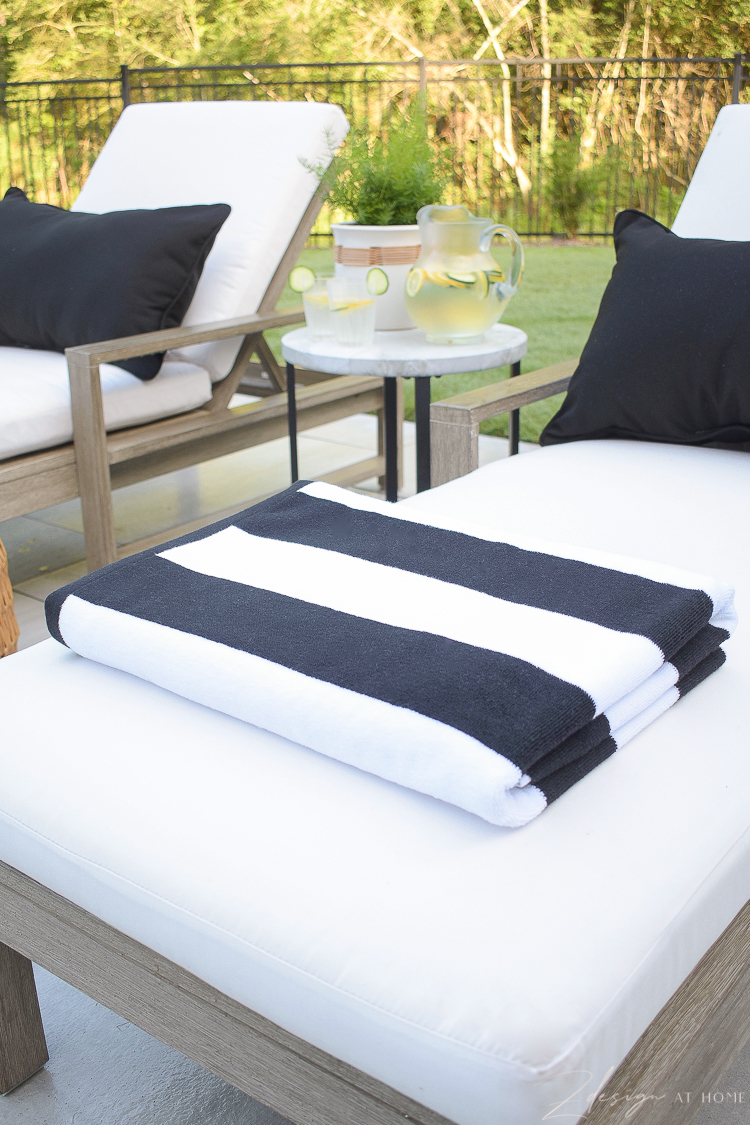 Black and white beach pool towels styled on patio loungers - Walmart Home