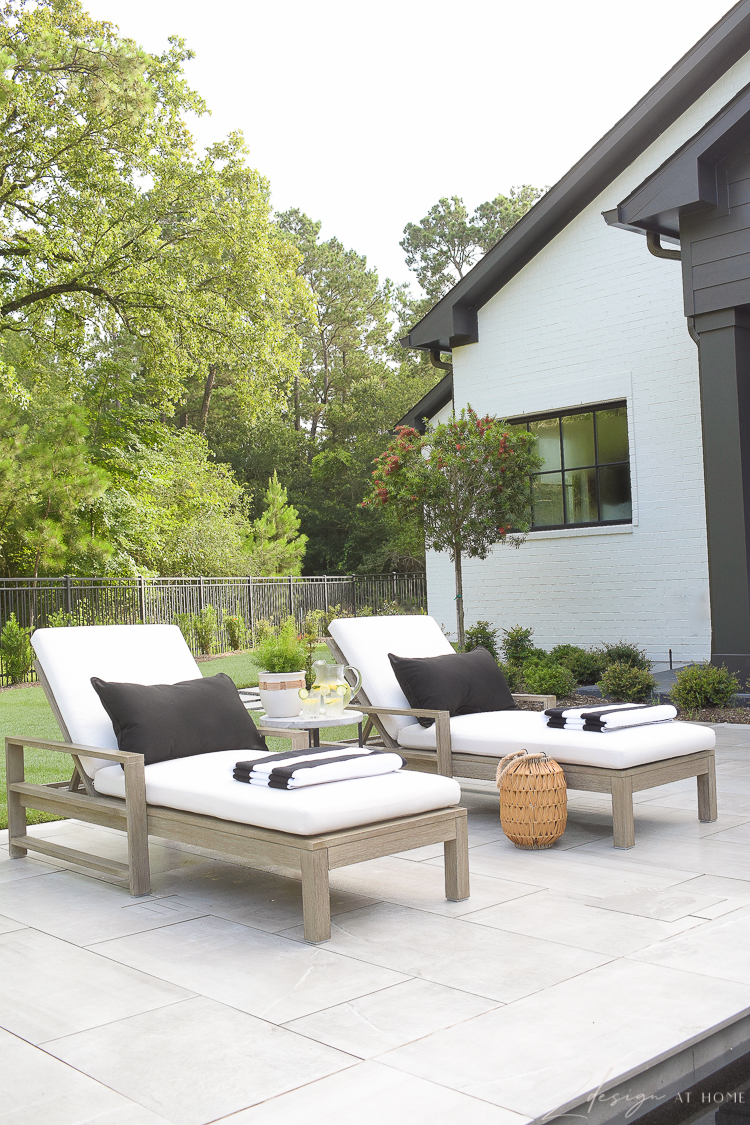 Walmart Home outdoor patio with loungers and black and white outdoor decor 