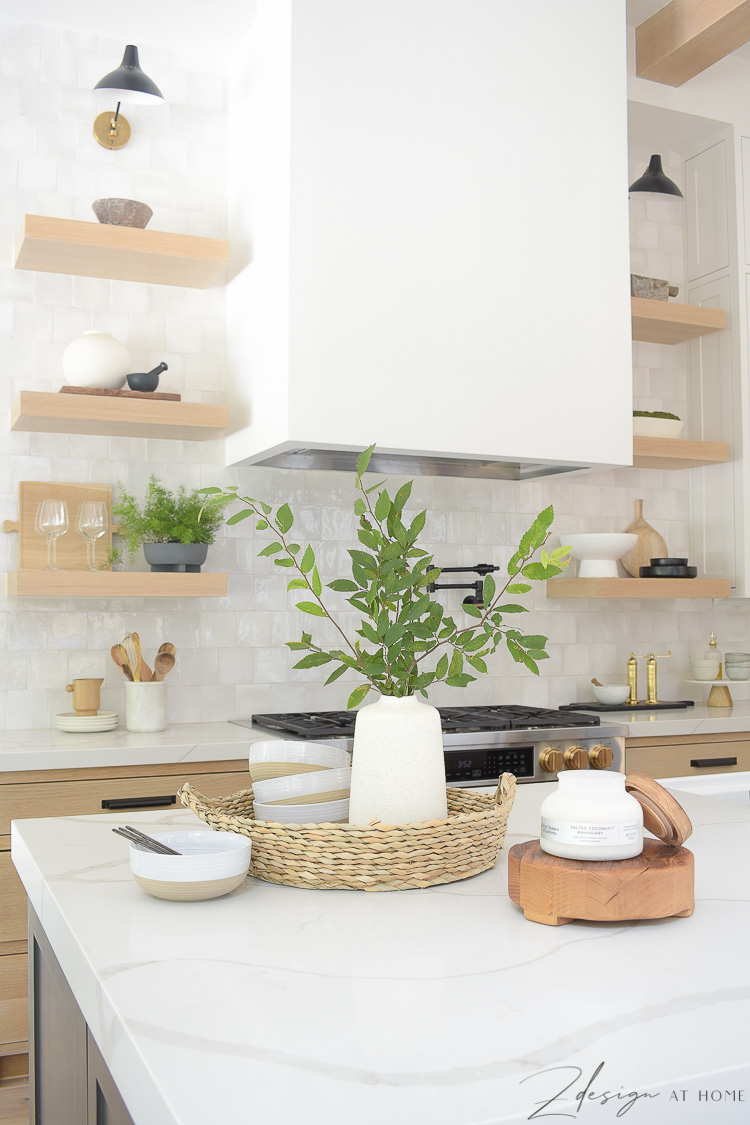 summer kitchen styled with basket, vase and candles - how to style your kitchen island 