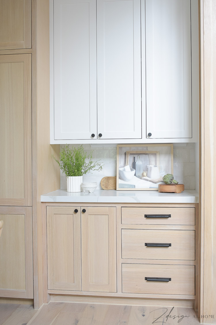 styled kitchen counters with white and white oak cabinets 