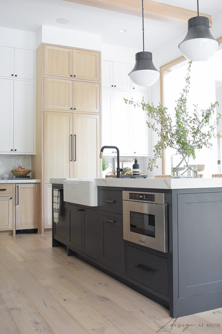 modern farmhouse kitchen with black white and white oak cabinets - black kitchen island