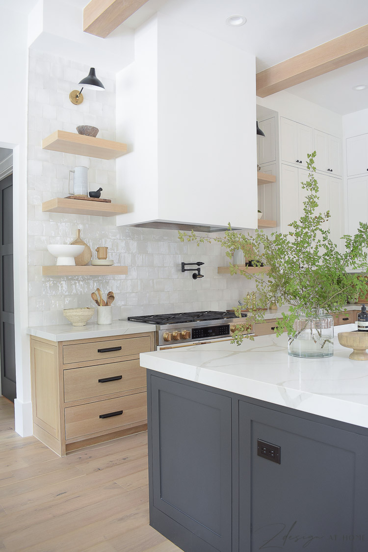 white oak shelves and range hood in modern farmhouse kitchen