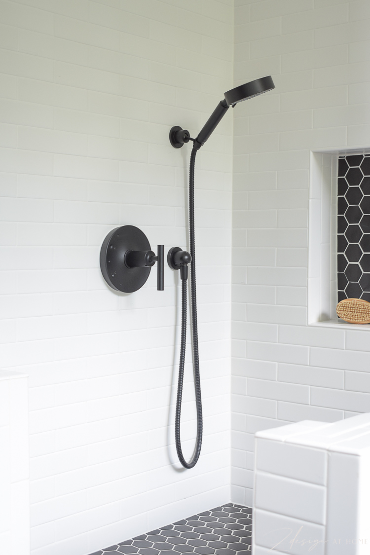 black Kohler hand shower used in dog wash