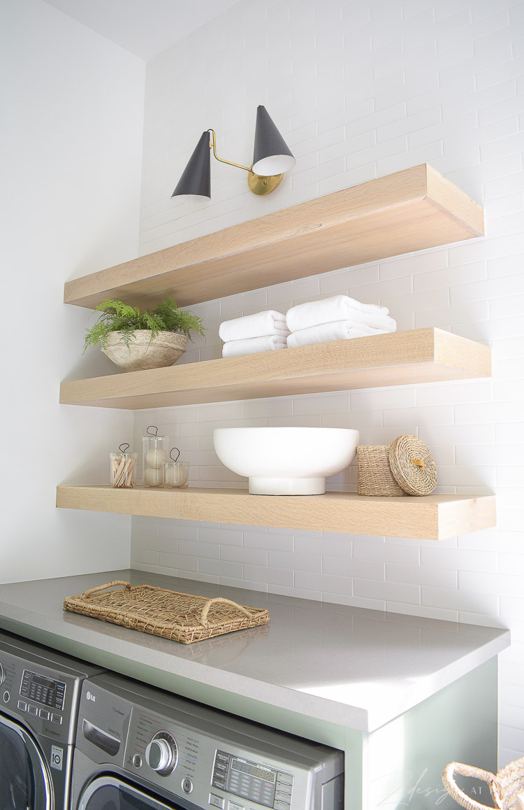 white oak laundry room shelves styled to perfection 