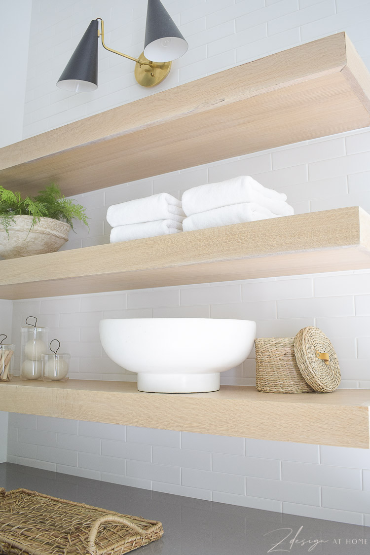 3" white oak laundry room shelves with sconce over head 