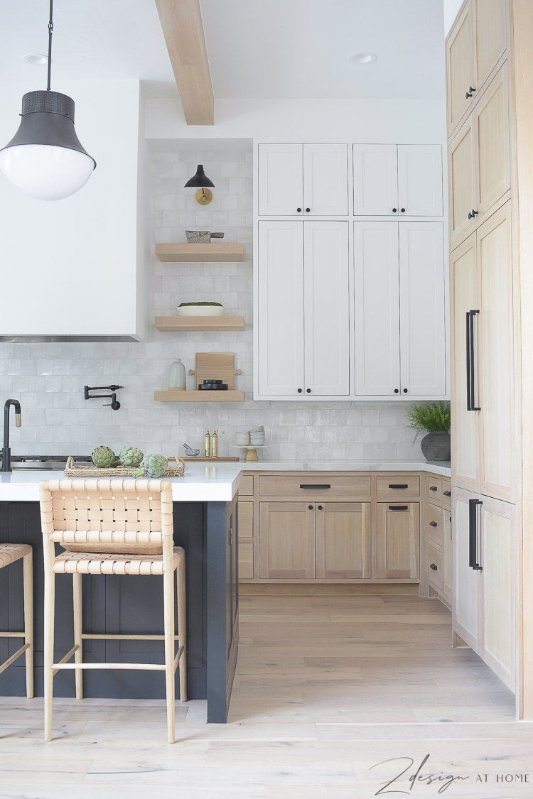 modern-farmhouse-kitchen-white-sheetrock-range-hood-white-oak-shelves-kitchen-with-three-cabeinet-colors-kelley-wearstler-precision-pendant