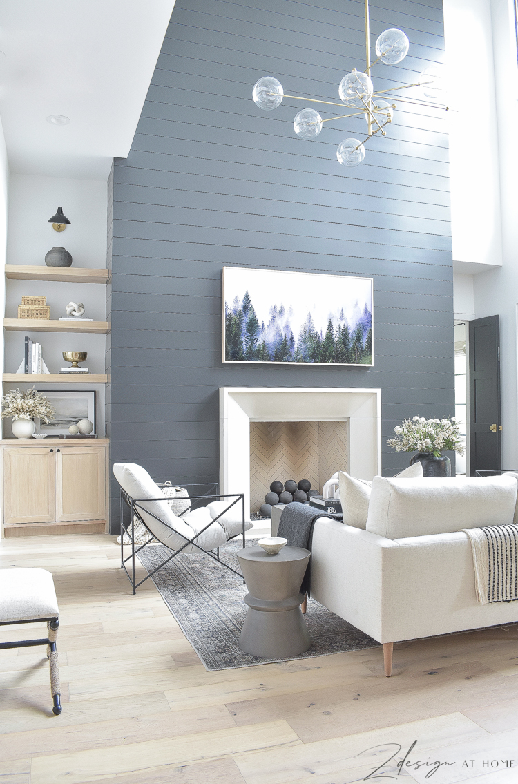 transitional modern living room styled for fall and black shiplap wall/fireplace