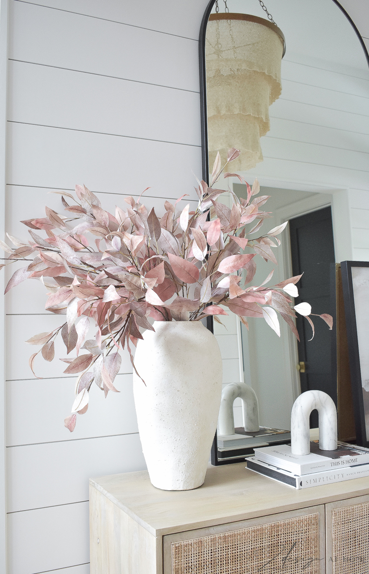 white texture vase with fall stems and march arch accessory 