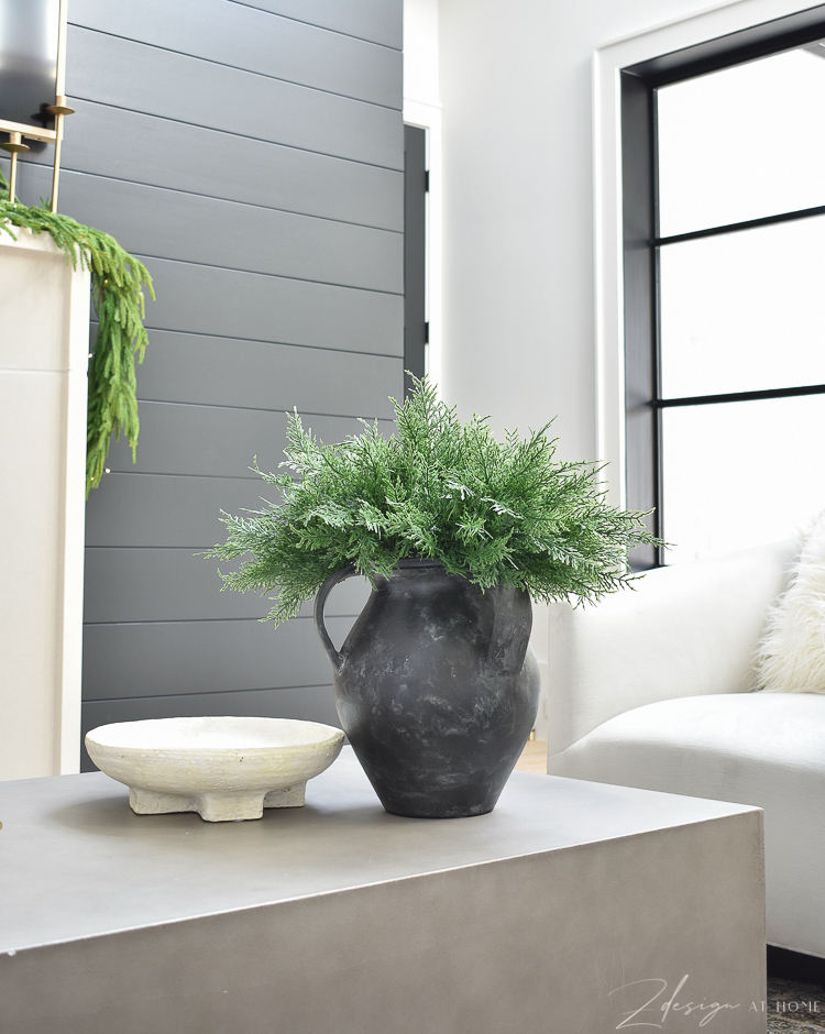 black vase jug with christmas greenery 