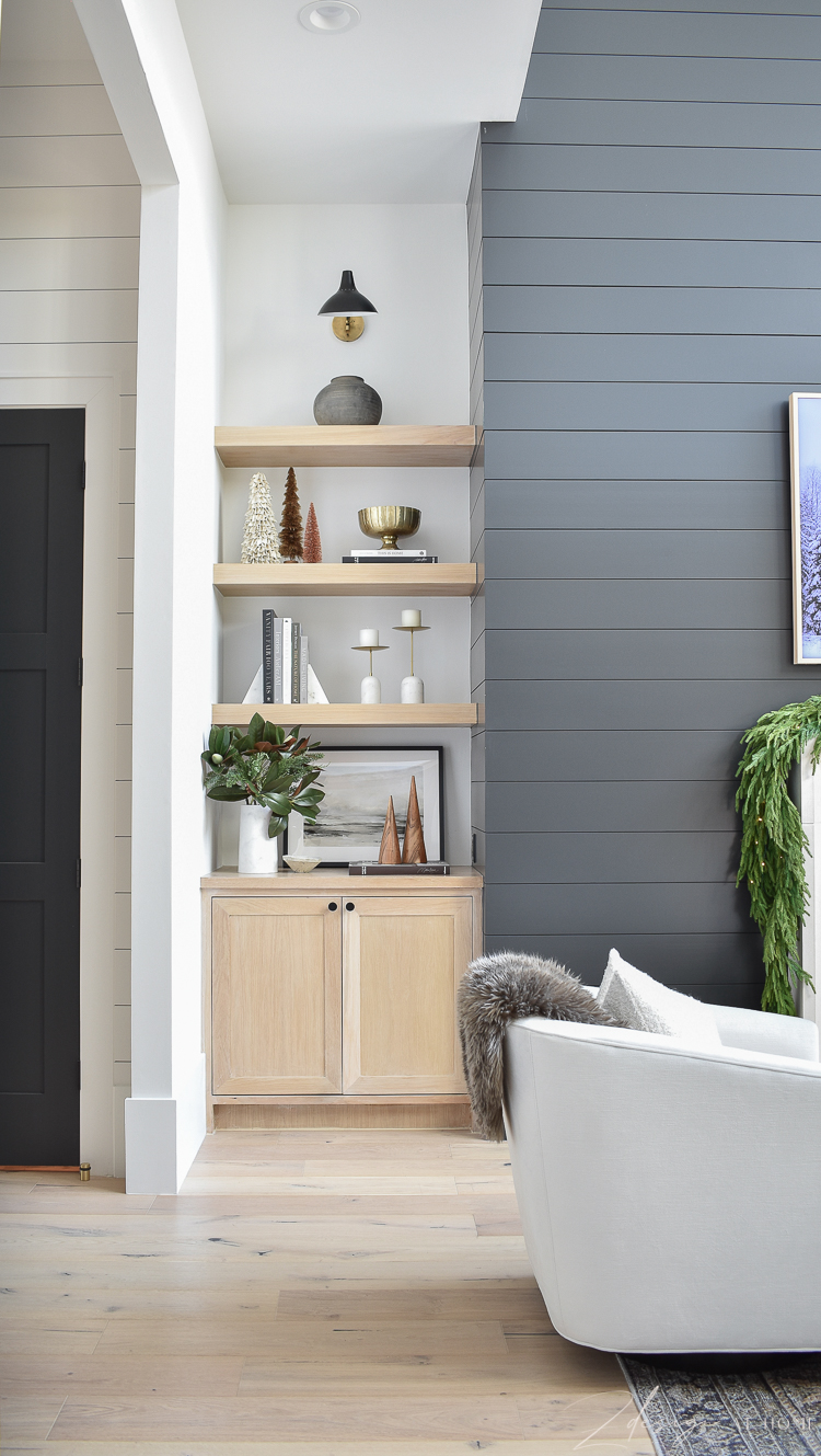 white oak bookshelves styled with modern christmas decor 