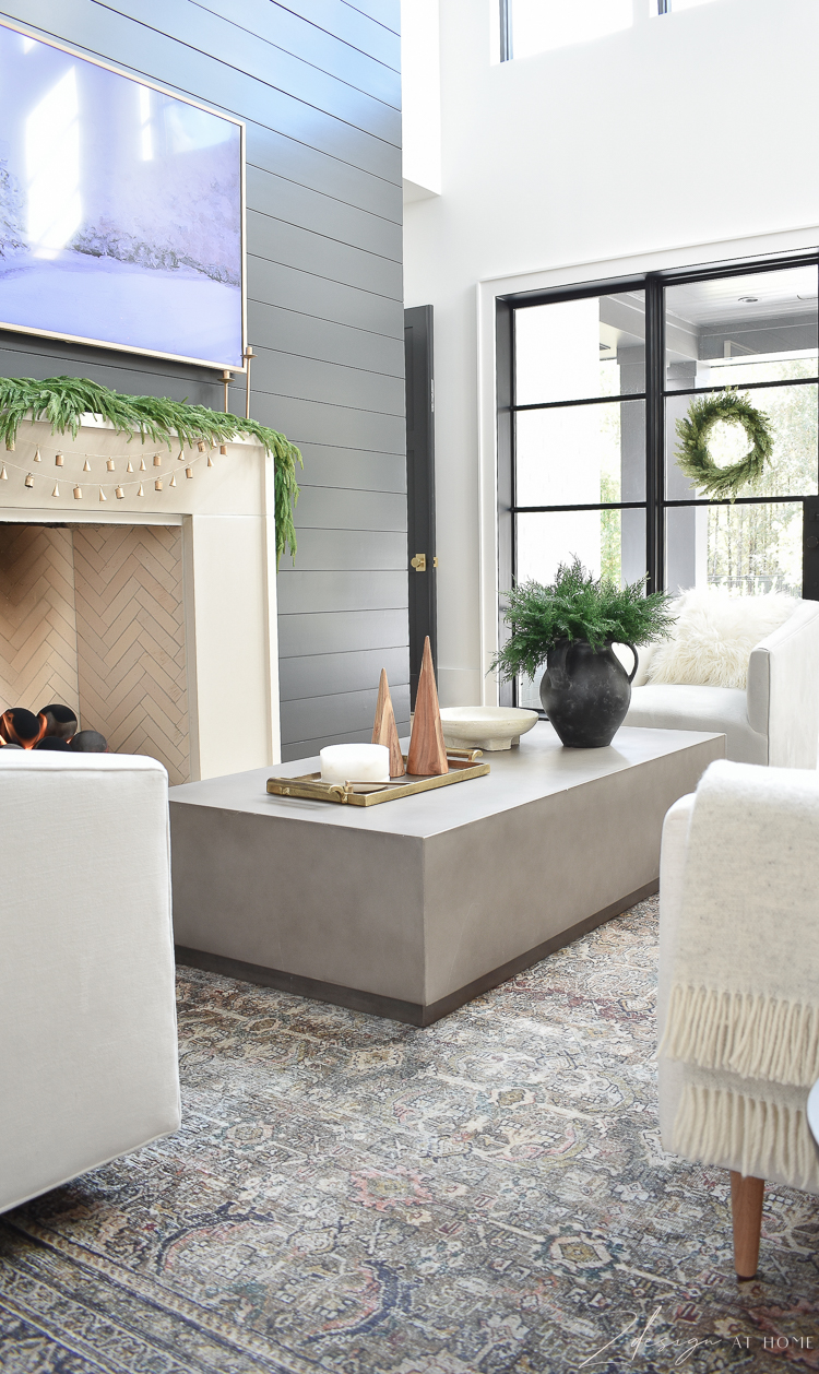 modern concrete coffee table styled with christmas decor 