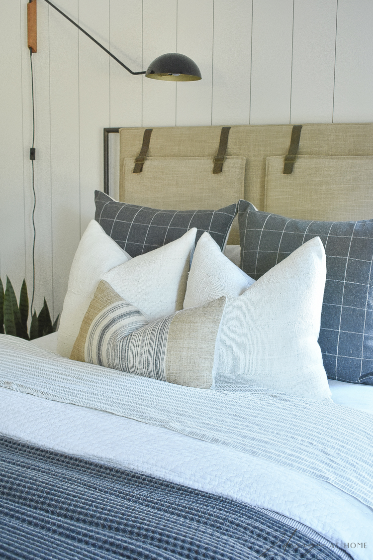 charcoal and white pillows in teenage boys room 