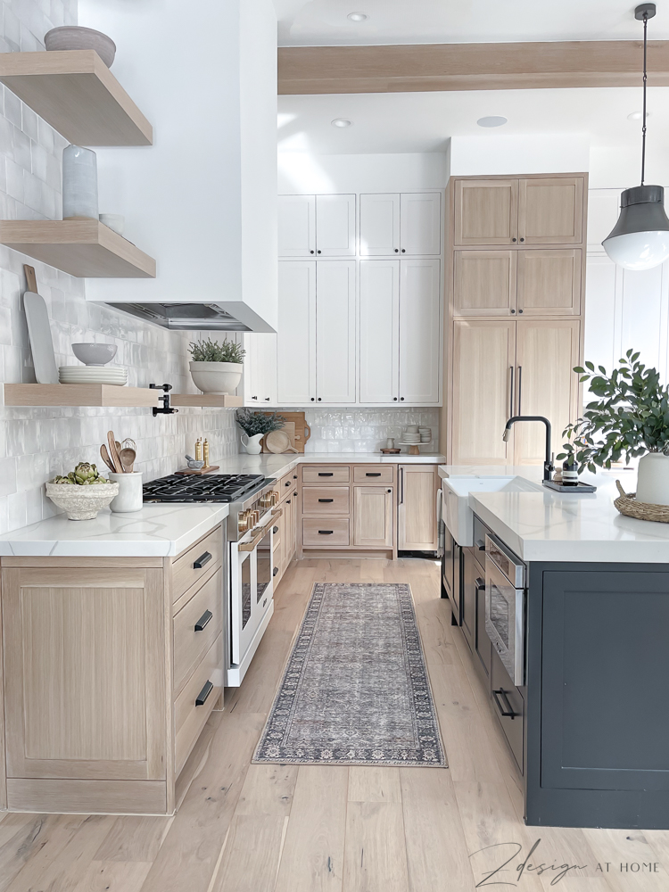 Kitchen with 3 cabinet colors and a Loloi Runner