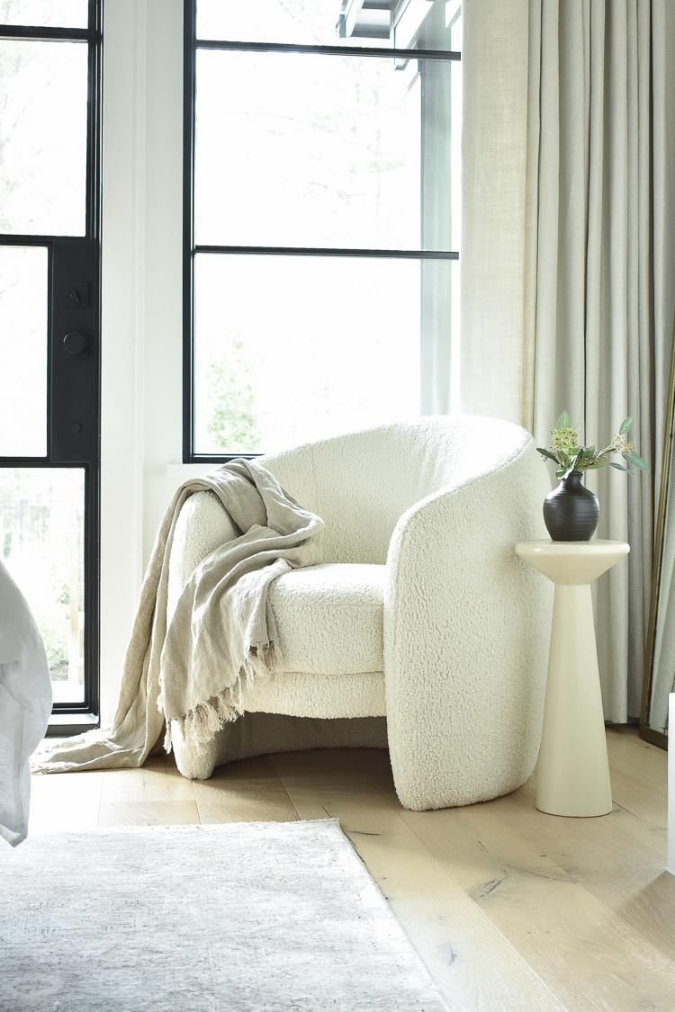 boucle chair in primary master bedroom 