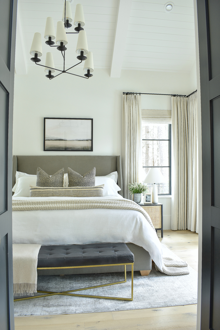 transitional moder McGee and co inspired bedroom with pleated curtains and fontaine chandelier 