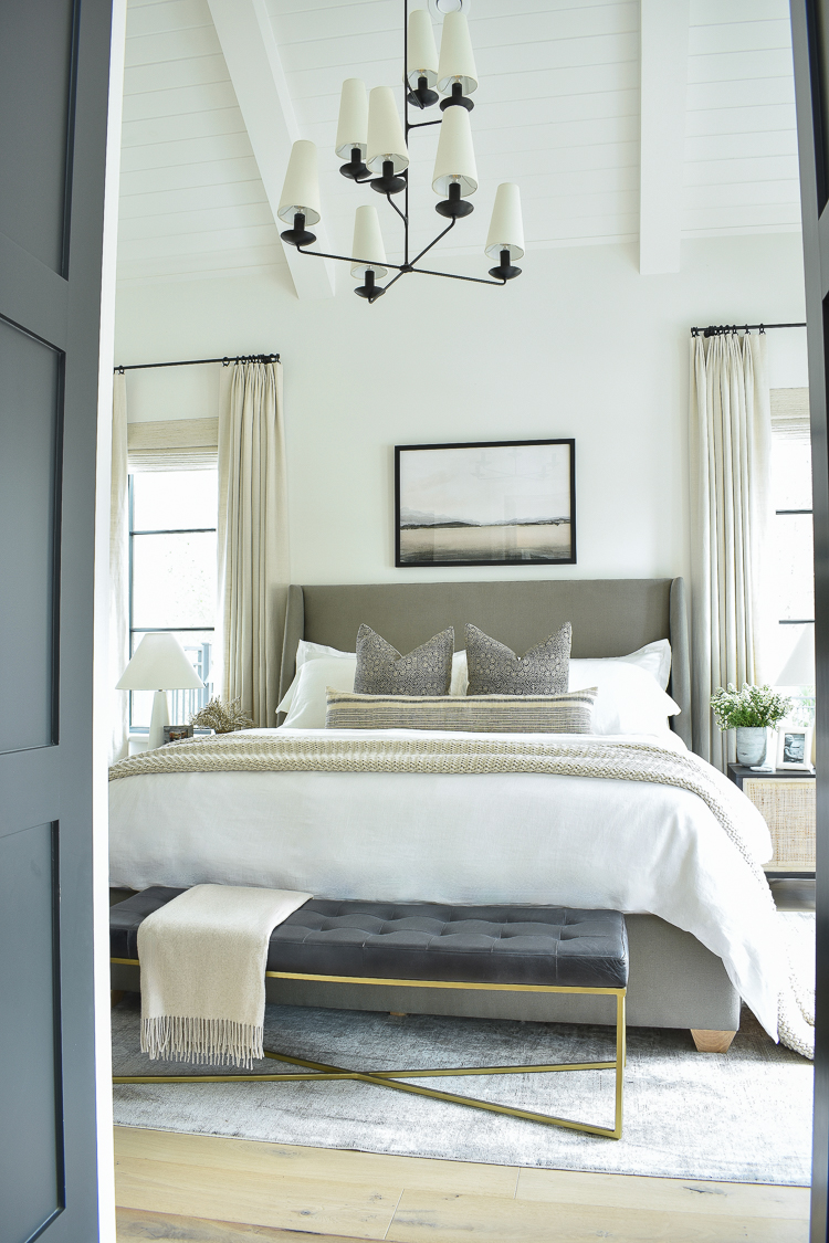 transitional modern mcgee and co inspired bedroom with white linen bedding and fountain chandelier, walt bed 
