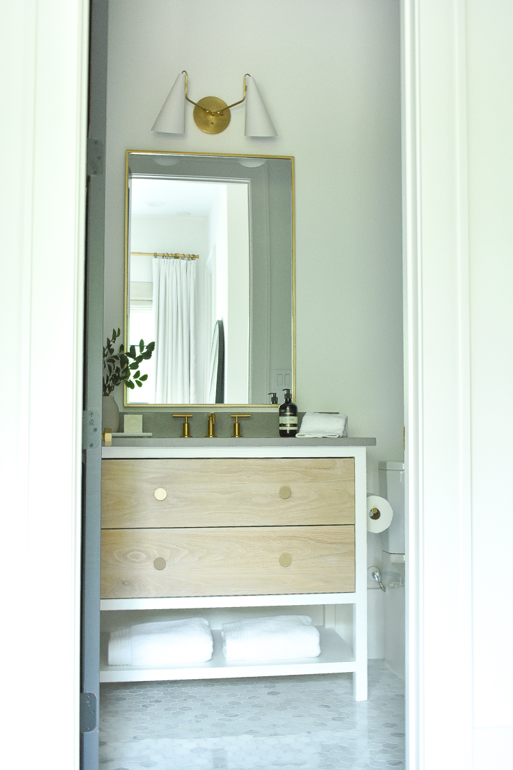 modern two-tone white and white oak bathroom vanity, hex marble floors