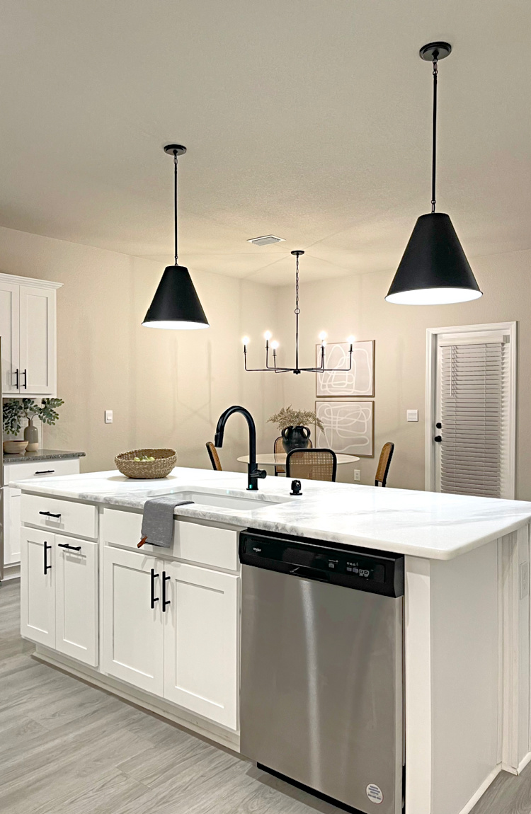 black pendants over marble kitchen island 