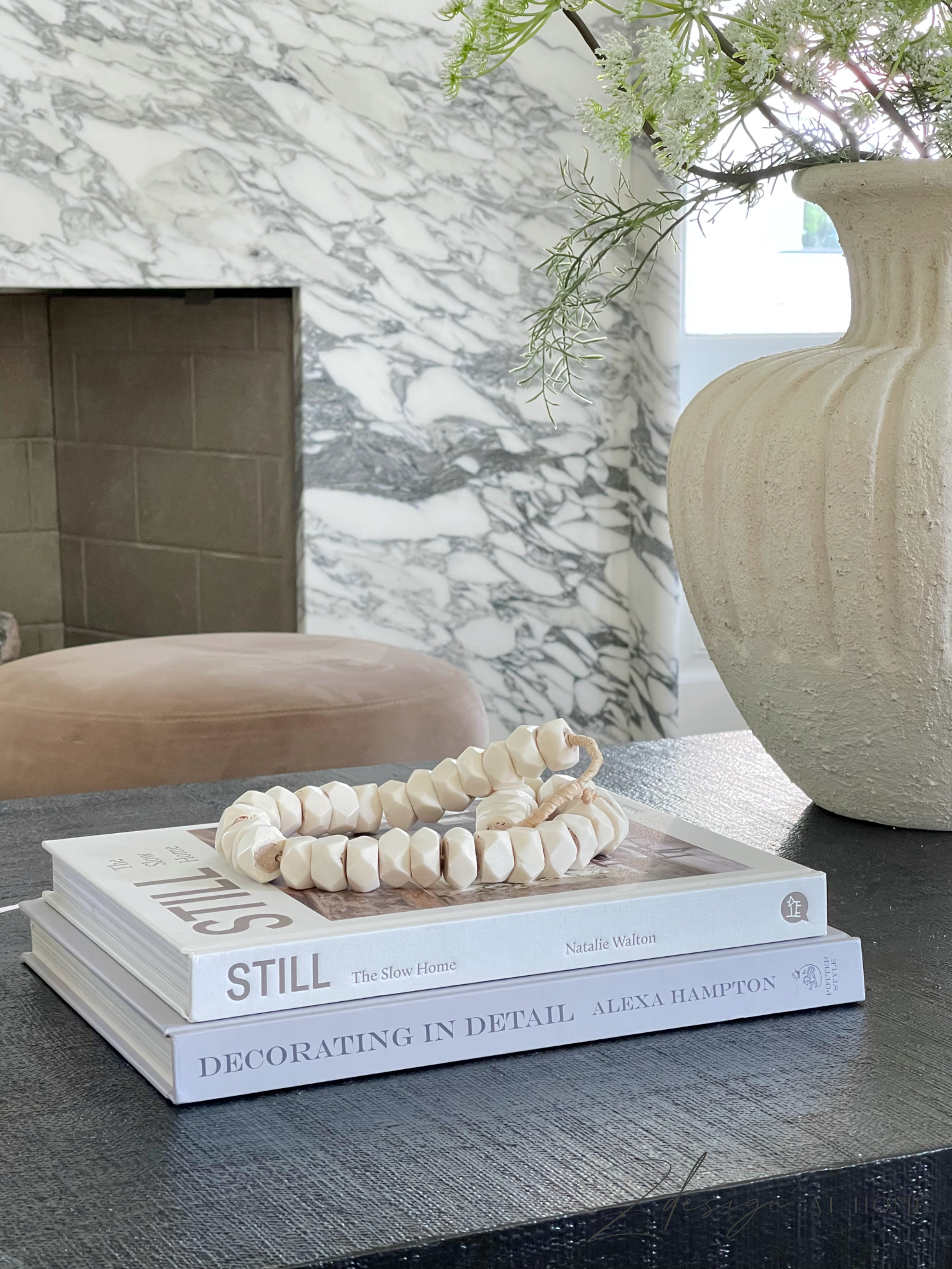 oversized books styled on coffee table 