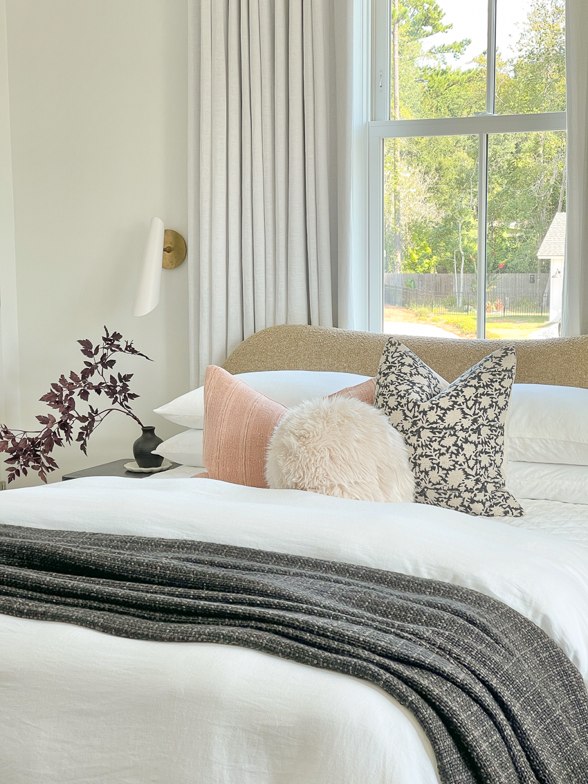 guest bedroom with white bedding, modern pillows and white linen drapery and a multipurpose guest room reveal