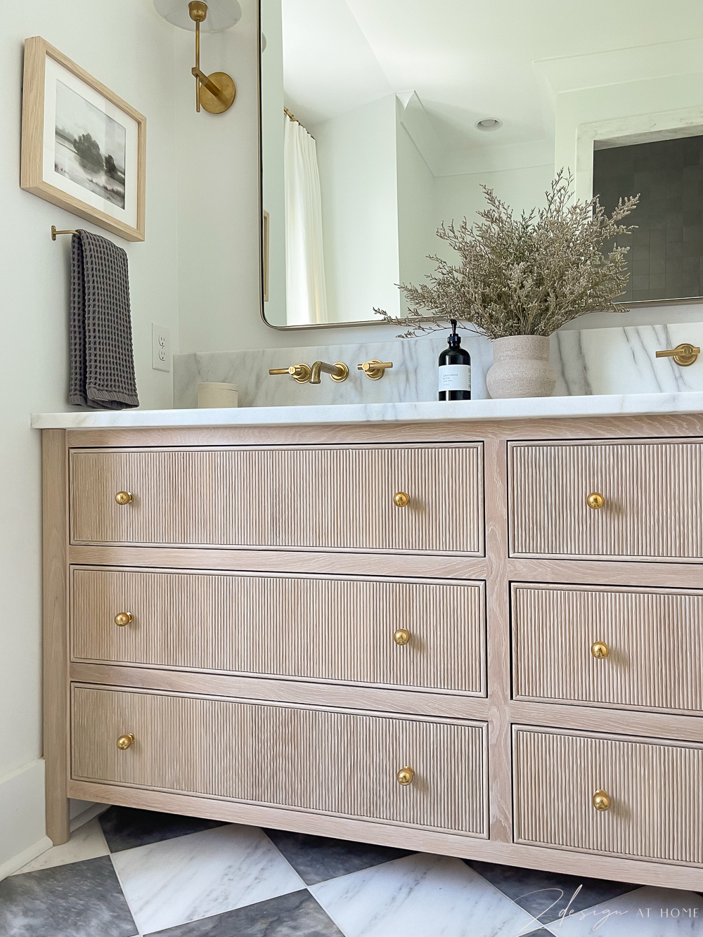 white oak vanity with fluted or reeded drawer faces and brass knobs