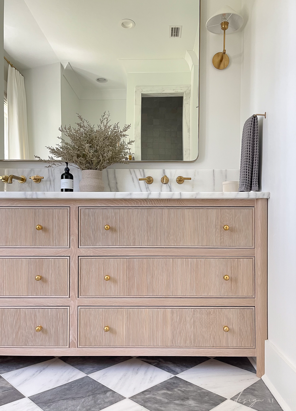 white oak vanity with fluted drawers in primary bath 