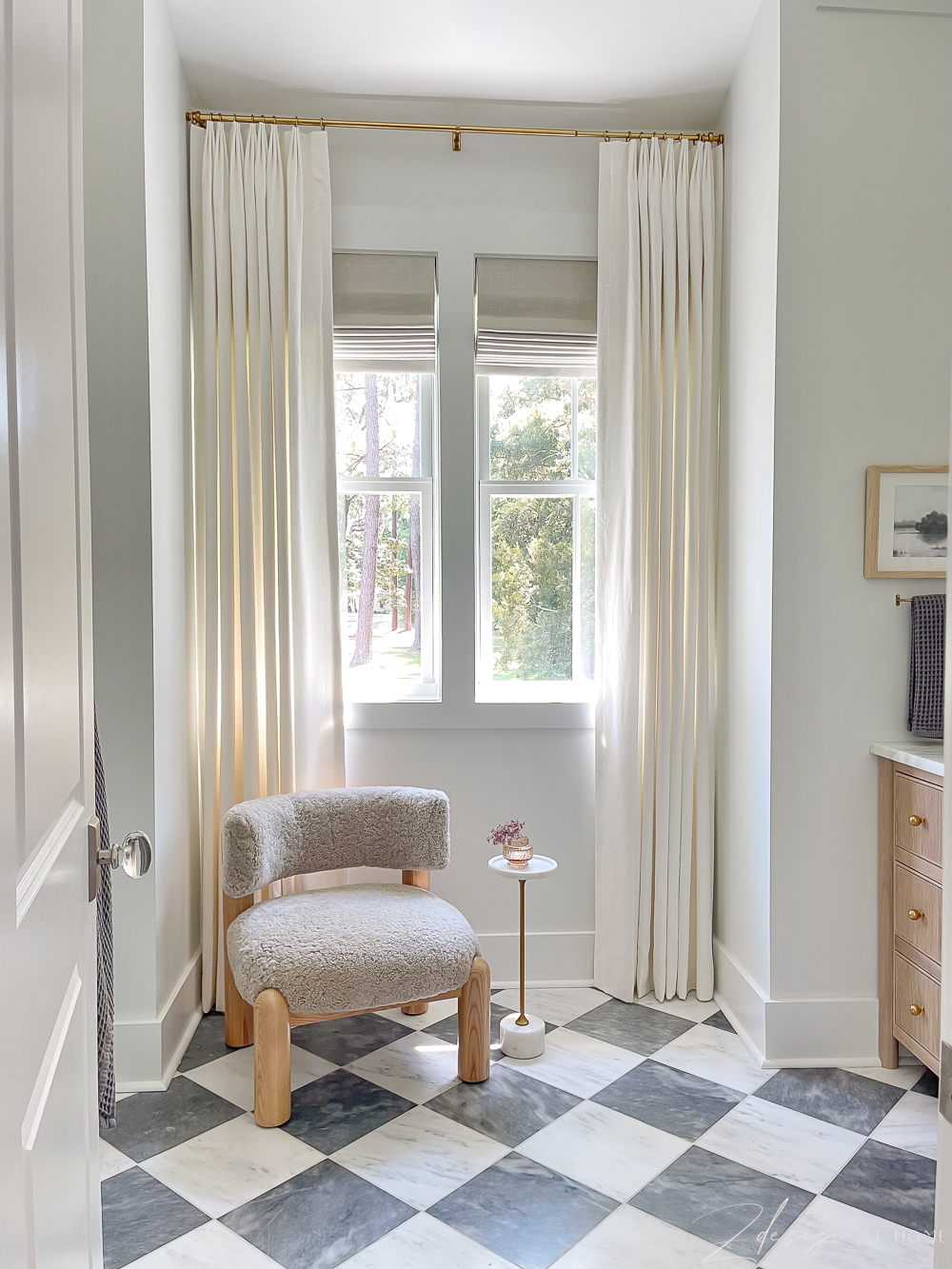 Primary bathroom with harlequin patterned marble floors 