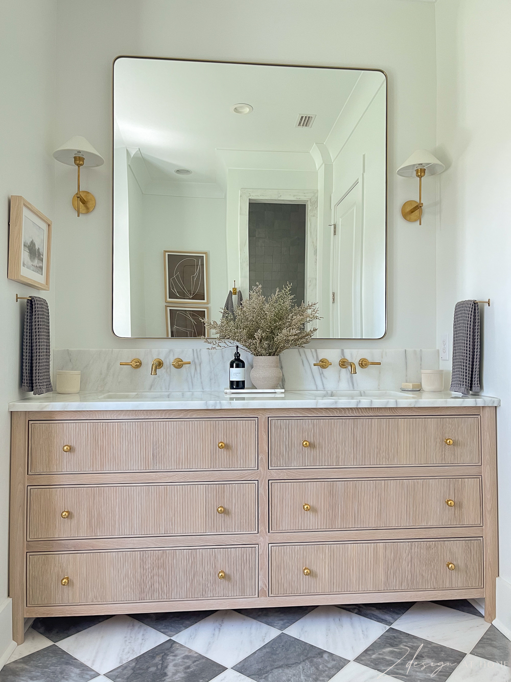 fluted white oak vanity with brass accents and marble countertops, checkered patterned marble floor 