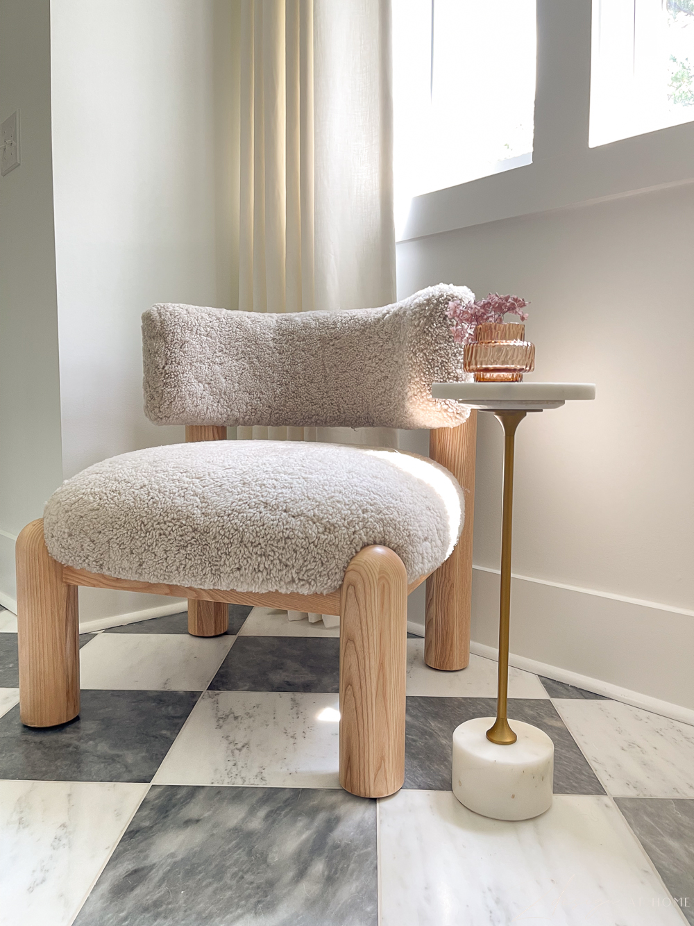 marble checkered bathroom flooring tile and harper shearling petite chair with marble and gold side table 