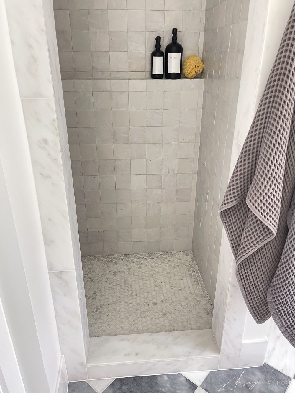 marble penny tile on shower floor and marble shower threshold 