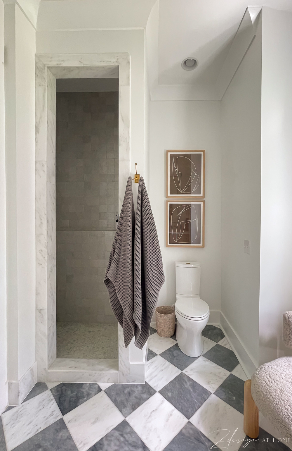 primary bath remodel with checkered marble floors and zellige tile shower 