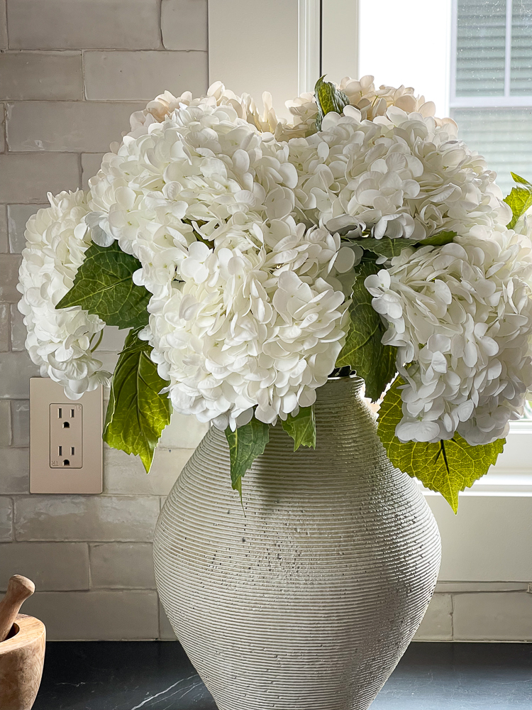 best faux Amazon hydrangeas - close up on black marble countertops 