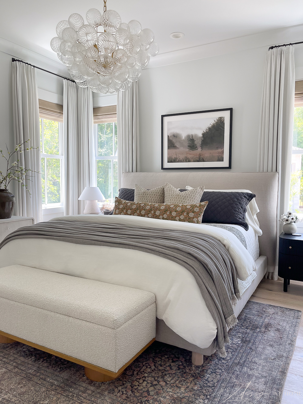 zdesign-at-home-layered-neutral-bedroom-pattern-white-linen-twopages-curtains-block-print-rust-olive-floral-pillow-boucle-storage-bench